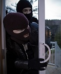 Home being broken into by residential burglars.