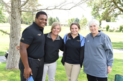 SLCC student Odassis Cheeks (l-r), SLCC President Deneece G. Huftalin, SLCC student Alyssa Wandell and Gail Miller on the Hidden Valley Country Club golf course.