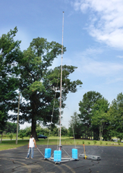 Technician demonstrates mobility of PLP-39-MOB portable lightning protection mast