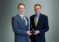 Rich Yezzi and Mark Muskevitsch of JX shown with the Deloitte 75 Award