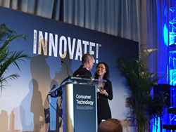Wei-Shin accepting Small Business of the Year Award at CEA Innovate!
