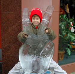 A boy poses with an ice sculpture at IceFest, the annual event which will be Jan 28 through Jan 31 this year!