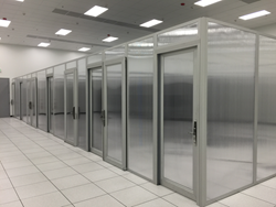 Colocation Suites are custom built onsite to add privacy, aid bypass airflow control, and improve aethetics