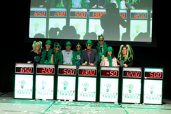 Cruise Planners always likes to do it differently and the 2015 cruise line executive panel includes top leaders playing a game show while showing their Cruise Planners green to an audience of more than 600 travel advisors. (L to R): Cruise Planners CEO an