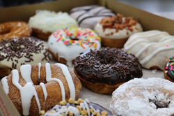 One dozen Duck Donuts donuts.