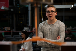 Dylan Moorman of Cheyenne Mountain High School in Colorado Springs watches his bridge being tested. Dylan won the Region 2 contest with an efficiency of 3,772.