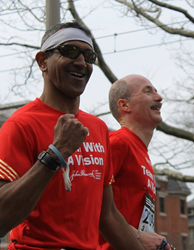 A visually impaired runner and guide compete in Boston Marathon