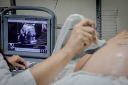Operation Blessing ultrasound tech using equipment from MedCorp LLC.