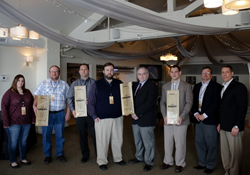 Billman Trucking, Dexter Axle, Key Electronics, and Peer Bearing (from left to right) were awarded the Wood-Mizer CREST Award for 2015.