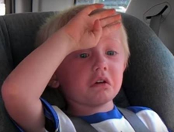 Kid sitting in car is hot.