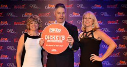 From left: ? and Roland Dickey of Dickey's Dickey’s Barbecue Pit and Cherryh Cansler of FastCasual.com.
