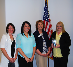 Leah Cridlin accepts 2016 Corporate College Award from Gateway.