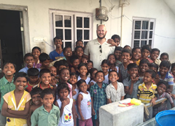 Andrew Smith with children at the Azlynn Noelle Children's Home