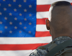 Soldier Looking at Flag
