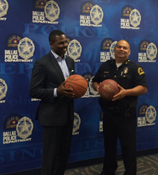 Pastor Richie Butler of St. Paul's United Methodist Church and first asst. chief Charles Cato of the Dallas Police Department strategize about the "Together We Ball" basketball game on Aug. 9, 2015