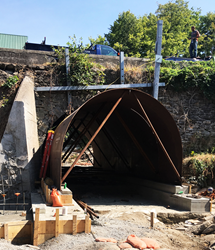 Low impact permanent rehabilitation system for historic stone arch bridge preservation