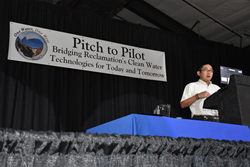 Keisuke Ikehata of Pacific Advanced Civil Engineering, pitches to the public their project Development of Novel Photobiological Process to Improve Water Recovery in Brackish Groundwater Desalination
