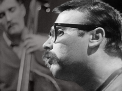 Vince Guaraldi, the man who composed "Cast Your Fate To The Wind" and "A Charlie Brown Christmas", in the recording studio in 1962.