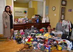 Stephanie Castillo, a former resident of Hillsides, a foster care charity, returned to her former home with holiday toys for the children.