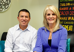 Cruise Planners earns highest award from Norwegian Cruise Line; Elite Travel Agency of the Year. Pictured: Andy Stuart, President of Norwegian Cruise Line and Michelle Fee, CEO of Cruise Planners.