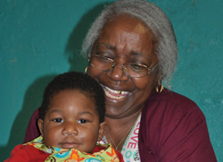 Early childhood educator and child wearing LENA's "talk pedometer technology