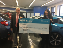 Howard Koeppel presents check to QSAC