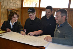 Bloom360 Founder Laura Rauman and team review the renovation plans