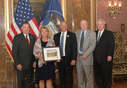 Salt Lake Community College officials were joined by Utah Gov. Gary Herbert (far left) in accepting an Envision Utah award for SLCC Promise.