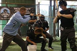 Academy Instructors teaching how to work behind home plate