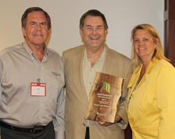 Tom Eggert, Executive Director of the WI Sustainability Council (middle), presenting the 2017 Sustainable Product of the Year Award to John Pade and Rebecca Nelson, co-founders of Nelson and Pade, Inc.