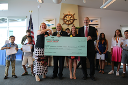 Engel & Völkers VEYTIA GROUP Laguna Beach awards $2000 check to GERMAN SCHOOL campus Newport Beach CA
