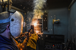A student in one of SLCC's welding courses.
