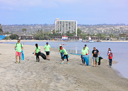 Employees of Evans Hotels participate in a beach cleanup