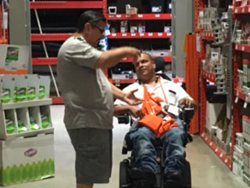 Lebron assists a customer in Home Depot.
