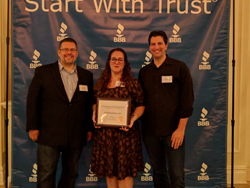 CCS Insurance owners and customer service manager with their award.