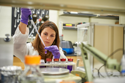 Nicole Wagner, CEO of UConn TIP company, LambdaVision, works in the lab (UConn Photo)