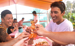 Enjoying Kahuku Garlic Shrimp on the Island and You tour