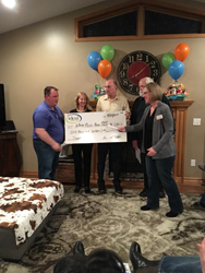 Photo of check donation to local food shelf