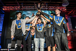 5 teenage boys with huge trophy in esports arena