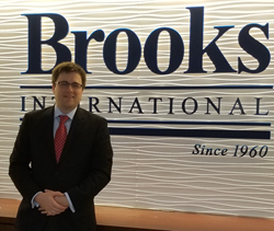 Brooks International promotes Jacob McAuliffe to Managing Analyst.