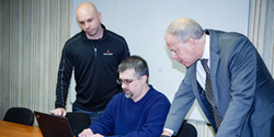 Two Kelser engineers assist a client.