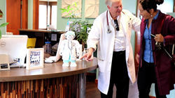Doctor is introducing the Happy 1.0 to a patient