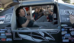 Elon Musk sitting in the Badgerloop Pod