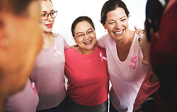 Group of women standing in support of each other.