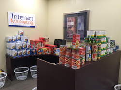 Food donations stacked up at reception desk at Interact Marketing for Hudson Valley Basket Brigade charity