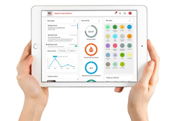 Hands holding an iPad with the HR4 software displayed.