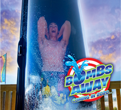 Boy stands in drop capsule waiting for ride to begin