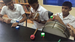 An earlier iteration of Muss-Bits, being tried out by deaf students in Sri Lanka.