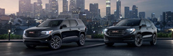 Two GMC Terrain crossover SUVs parked next to each other