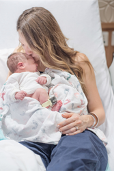 Newborn infant and mother